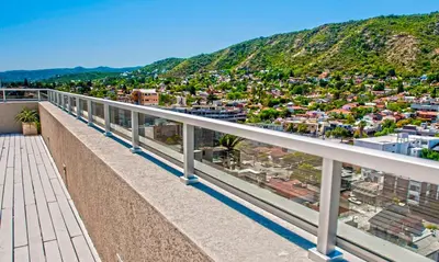 a balcony with a view of a city at Torre Opera Depto 3º B in Villa Carlos Paz