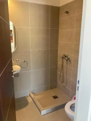 a bathroom with a shower with a toilet and a sink at Casal Sur in Potrero de Garay