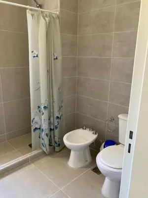 a bathroom with a toilet and a sink at Casal Sur in Potrero de Garay