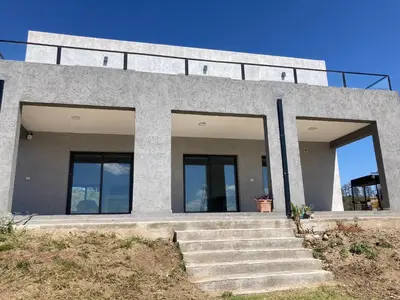 a concrete building with stairs in front of it at Casal Sur in Potrero de Garay