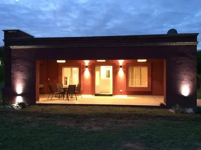 a small house with a patio at night at Casonas de Nono in Nono
