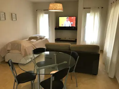 a living room with a couch and a glass table at Casonas de Nono in Nono