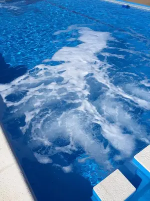 a pool of water with clouds in the water at Casonas de Nono in Nono