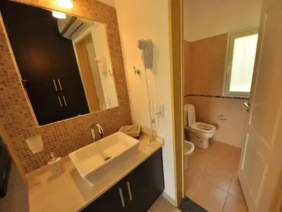 a bathroom with a sink and a toilet and a mirror at Casonas de Nono in Nono