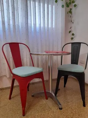 two chairs and a table and a table and a table at Mi lugar, tu lugar in Cordoba