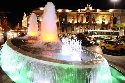 a water fountain in front of a building at night at Mi lugar, tu lugar in Cordoba