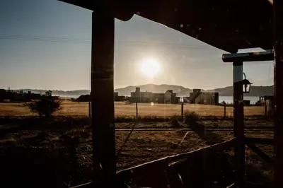 a view of the sun setting in a field at Cabaña La Maura in La Estancia