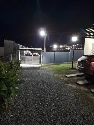 a car parked next to a fence at night at El 8 del mirador in Villa Santa Cruz del Lago