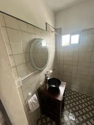 a bathroom with a sink and a mirror at Tempo Suites in Cordoba