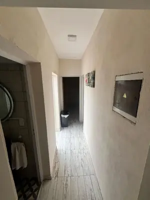 an empty hallway with a toilet in a room at Tempo Suites in Cordoba