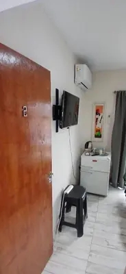 a room with a door and a stool in a room at Tempo Suites in Cordoba