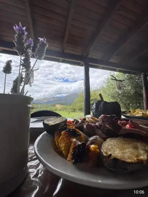 a plate of food sitting on a table at Cabaña Los Espinillos in Cortaderas
