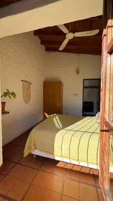 a bedroom with a bed in a room at Casita Lavanda - cercana a plaza de Villa de las Rosas con patio y asador in Villa de Las Rosas