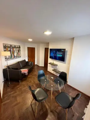 a living room with a couch and chairs and a table at Paseo del Boulevard Suite in Cordoba