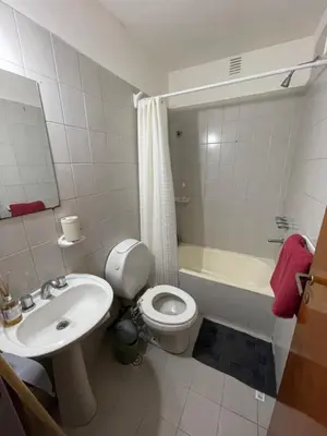 a bathroom with a sink and a toilet and a tub at Monoambiente en Nueva Córdoba in Cordoba