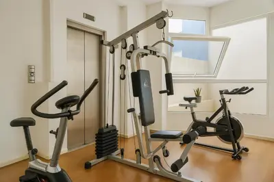 a gym with two exercise bikes in a room at Coral State Premium Tower in Cordoba