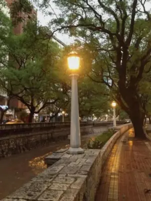 a light pole on a brick sidewalk in a park at cordoba departamentos por dia cañada in Cordoba