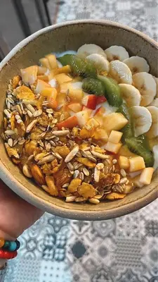 a bowl of food with vegetables and nuts at Casa Raíz Cumbrecita in La Cumbrecita