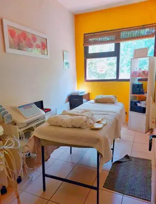 a room with a bed and a table in it at Cabañas spa el petrel in San Javier