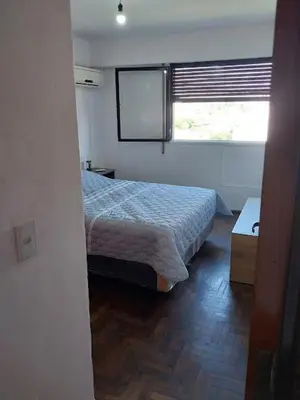 a small bedroom with a bed and a window at Nueva Córdoba Argentina externo luminoso in Cordoba