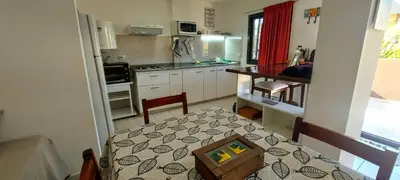 a kitchen with a table with a box on it at Oasis, departamento en Carlos paz in Villa Carlos Paz