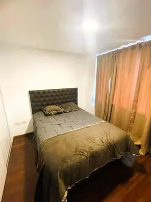 a bedroom with a bed in a room with a window at Elegante en B° General Paz in Cordoba