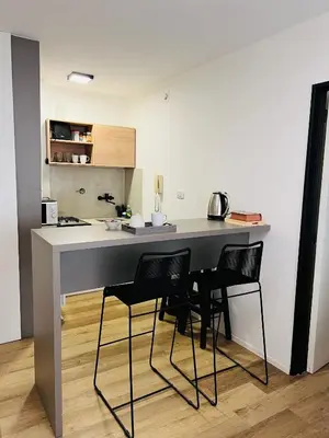 a kitchen with a table and chairs in a room at Departamento confortable centro Wi Fi - cochera opcional in Cordoba
