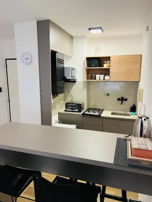 a kitchen with a counter top in a room at Departamento confortable centro Wi Fi - cochera opcional in Cordoba