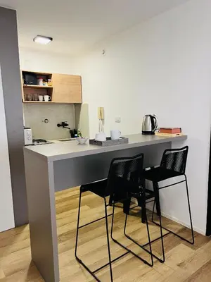 a kitchen with a table and chairs in a room at Departamento confortable centro Wi Fi - cochera opcional in Cordoba