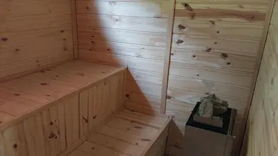 a sauna with wooden walls and wooden floors at Cabañas walcarpi in Villa Ciudad Parque