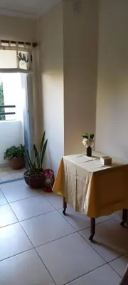 a table with a yellow table cloth on it in a room at Bedoya in Cordoba