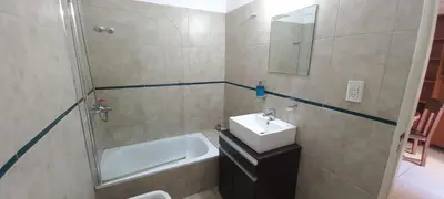 a bathroom with a sink and a bath tub at Bedoya in Cordoba