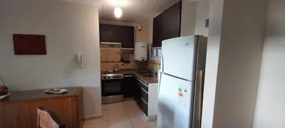 a kitchen with a white refrigerator and a sink at Bedoya in Cordoba