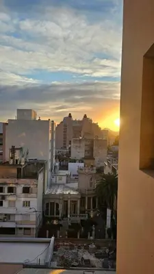 a view of a city at sunset from a building at ALTOS DE COLON in Cordoba