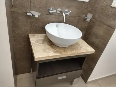 a bathroom with a white bowl sink on a counter at Zona residencial frente al lago! in Villa Carlos Paz