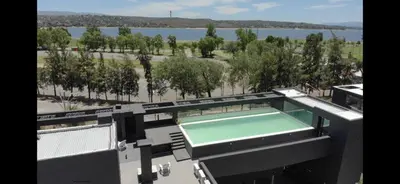 a view of a swimming pool on top of a building at Zona residencial frente al lago! in Villa Carlos Paz