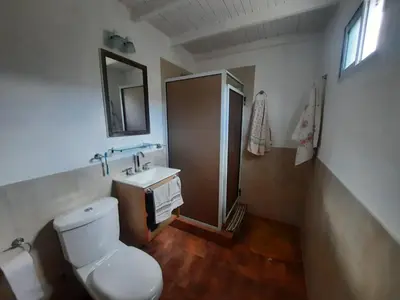 a bathroom with a toilet and a sink and a mirror at La Dulce in San Javier