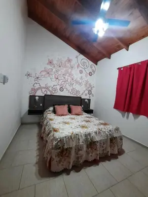 a bedroom with a bed with two pink pillows on it at La Dulce in San Javier
