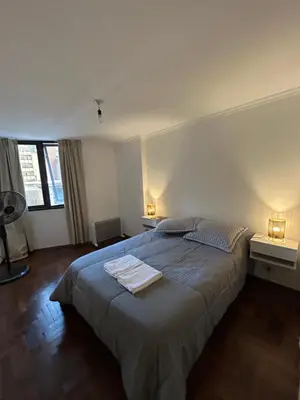 a bedroom with a bed with two towels on it at Departamento EL QUINTANAR 2 in Cordoba