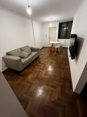 a living room with a couch and a table at Departamento EL QUINTANAR 2 in Cordoba