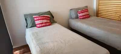 two beds sitting next to each other in a room at Adri in Cordoba