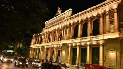 a large building with cars parked in front of it at Adri in Cordoba