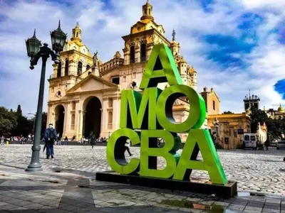 a large green sign in front of a building at Adri in Cordoba
