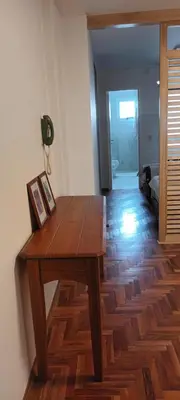 a wooden table in a room with a hallway at Adri in Cordoba