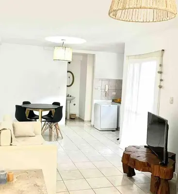 a living room with a couch and a table at Departamento Triana in Cordoba