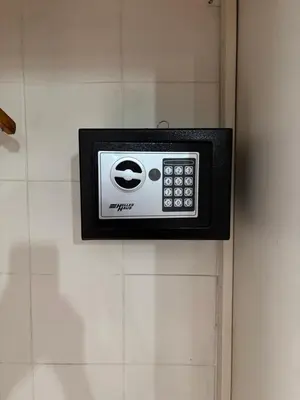 a soap dispenser on the wall of a bathroom at Departamentos del Cerro in Cordoba