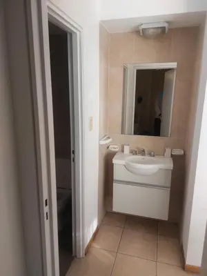 a bathroom with a sink and a mirror at Buenas vistas apartment in Cordoba