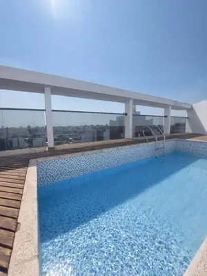 a swimming pool on the roof of a building at Buenas vistas apartment in Cordoba