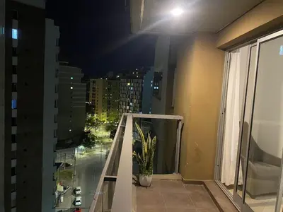 a balcony with a view of a city at night at Buenas vistas apartment in Cordoba