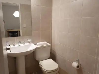 a bathroom with a toilet and a sink at Locador Nueva Cordoba 5A in Cordoba